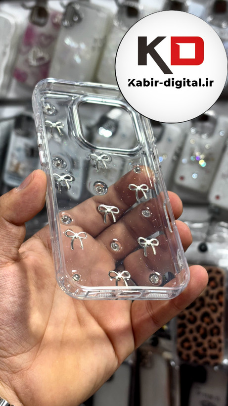 قاب گوشی iPhone 16proآیفون طرح اکلیلی رزینی پشت طلق شفاف لاکچری پاپیونی کرومی