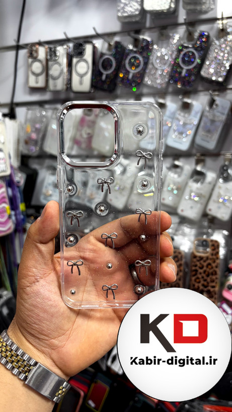قاب گوشی iPhone15Promaxآیفون طرح اکلیلی رزینی پشت طلق شفاف لاکچری پاپیونی کرومی