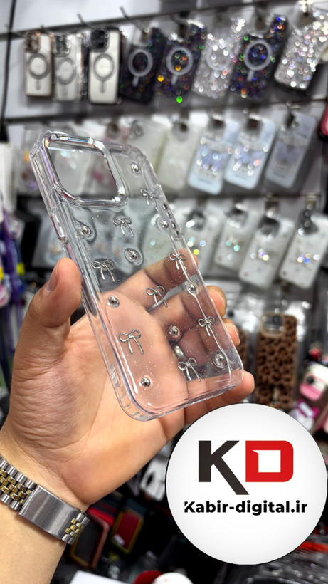 قاب گوشی iPhone15Promaxآیفون طرح اکلیلی رزینی پشت طلق شفاف لاکچری پاپیونی کرومی