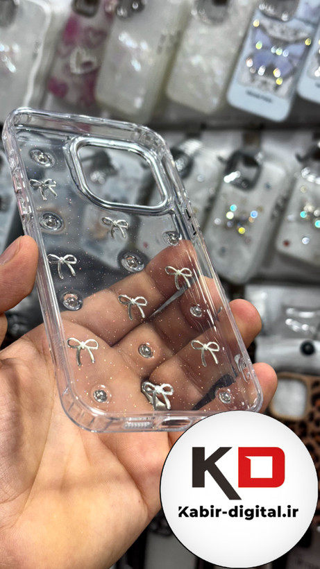 قاب گوشی iPhone15Promaxآیفون طرح اکلیلی رزینی پشت طلق شفاف لاکچری پاپیونی کرومی