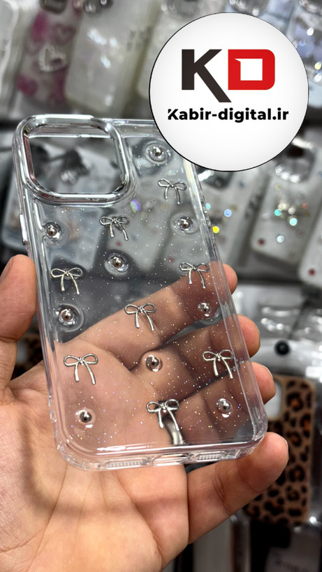 قاب گوشی iPhone15Promaxآیفون طرح اکلیلی رزینی پشت طلق شفاف لاکچری پاپیونی کرومی