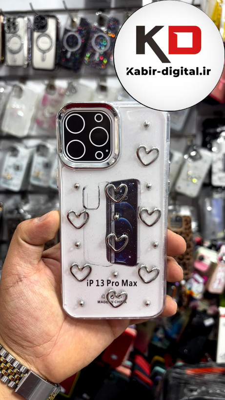 قاب گوش iPhone13Promaxآیفون لاکچری شفاف رزینی طرح شاین لنز کرومی طرح قلب