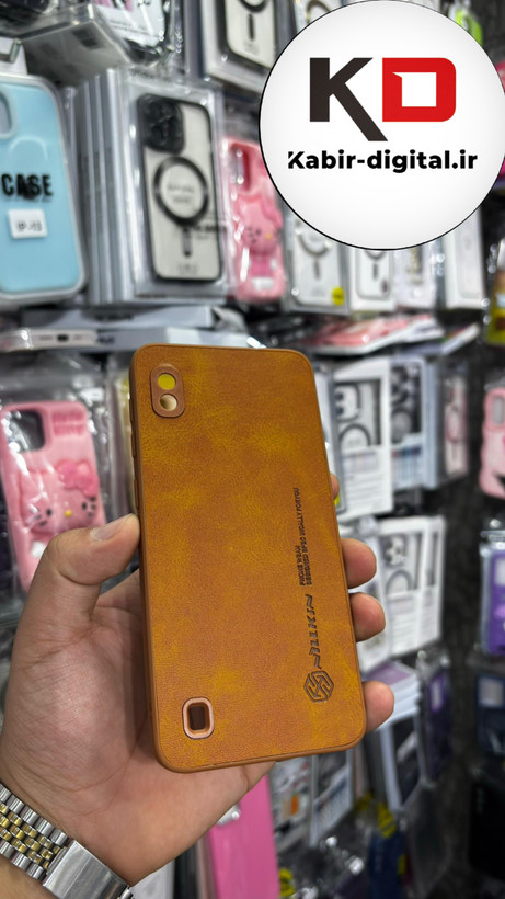 قاب گوشی Galaxy A10 سامسونگ نیلکین NILLKIN سوزنی چرمی محافظ لنز دار عسلی