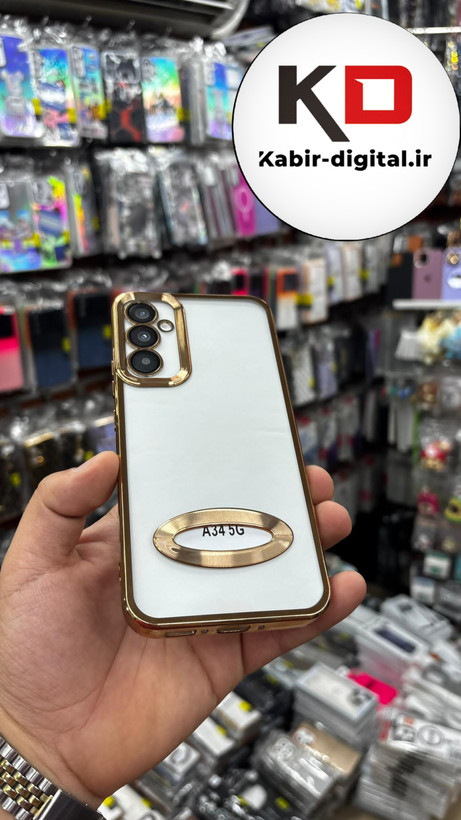 قاب گوشی Galaxy A34 سامسونگ طرح الکتروپلیتینگ ژله ای شفاف اورجینال طرح مگ سیف محافظ لنز دار طلایی