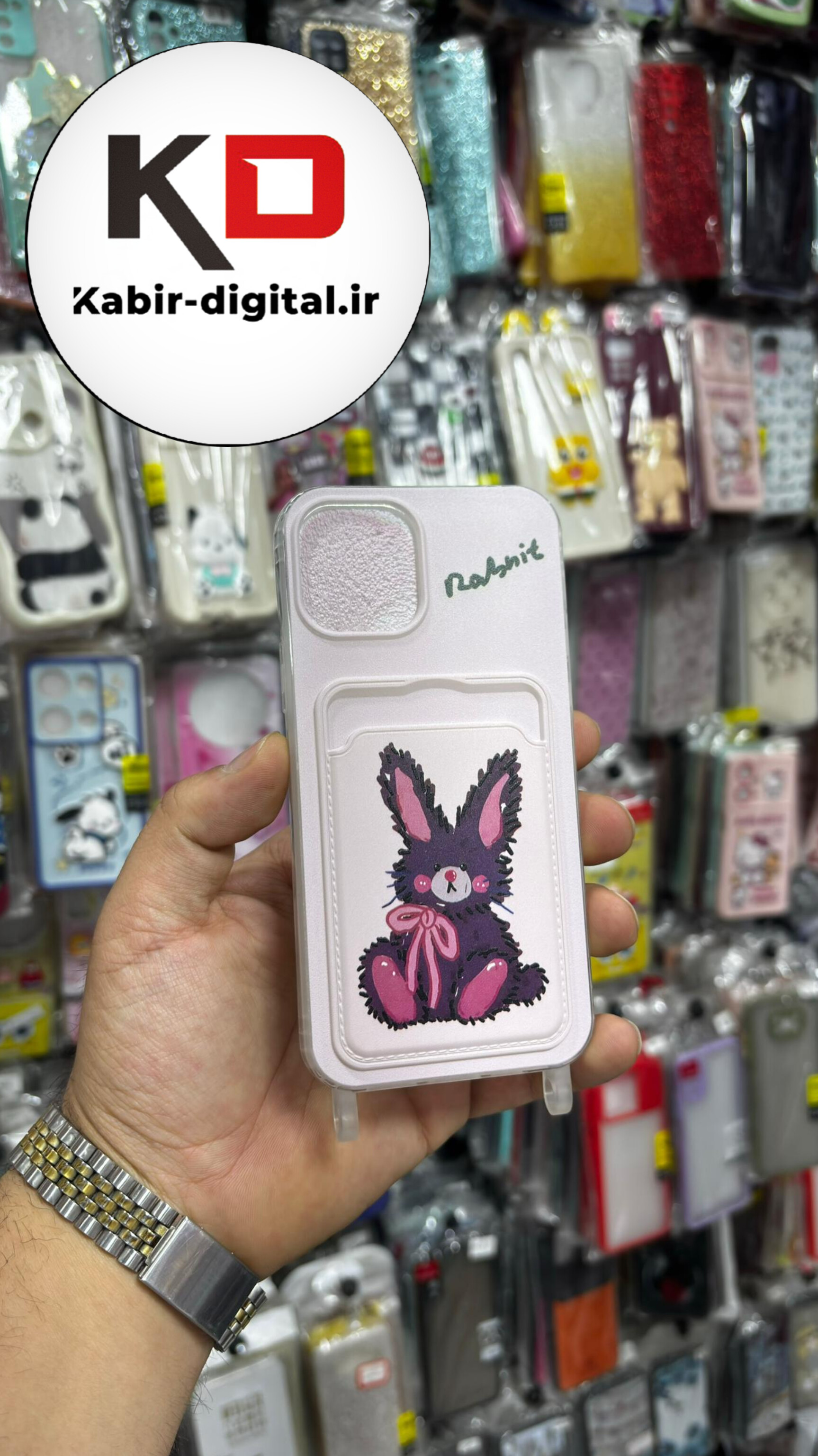 قاب گوشی iPhone 13 - iPhone 14 آیفون  اورجینال ژله ای جاکارتی دار کپسولی به همراه بند آویز دوطرفه طرح خرگوش کیوت