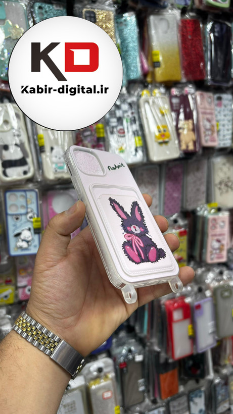 قاب گوشی iPhone 13 - iPhone 14 آیفون اورجینال ژله ای جاکارتی دار کپسولی به همراه بند آویز دوطرفه طرح خرگوش کیوت