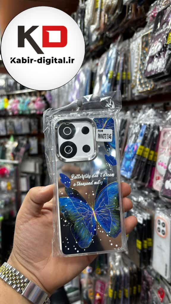 قاب گوشی Redmi Note 13 4G شیائومی اورجینال فانتزی سخت آینه ای لنز کرومی ایربگ دار طرح پروانه آبی کیوت