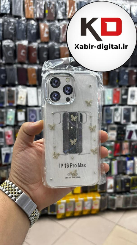 قاب گوشی iPhone 16 Pro Maxآیفون لاکچری شفاف رزینی طرح شاین لنز کرومی طرح پروانه نگین دار
