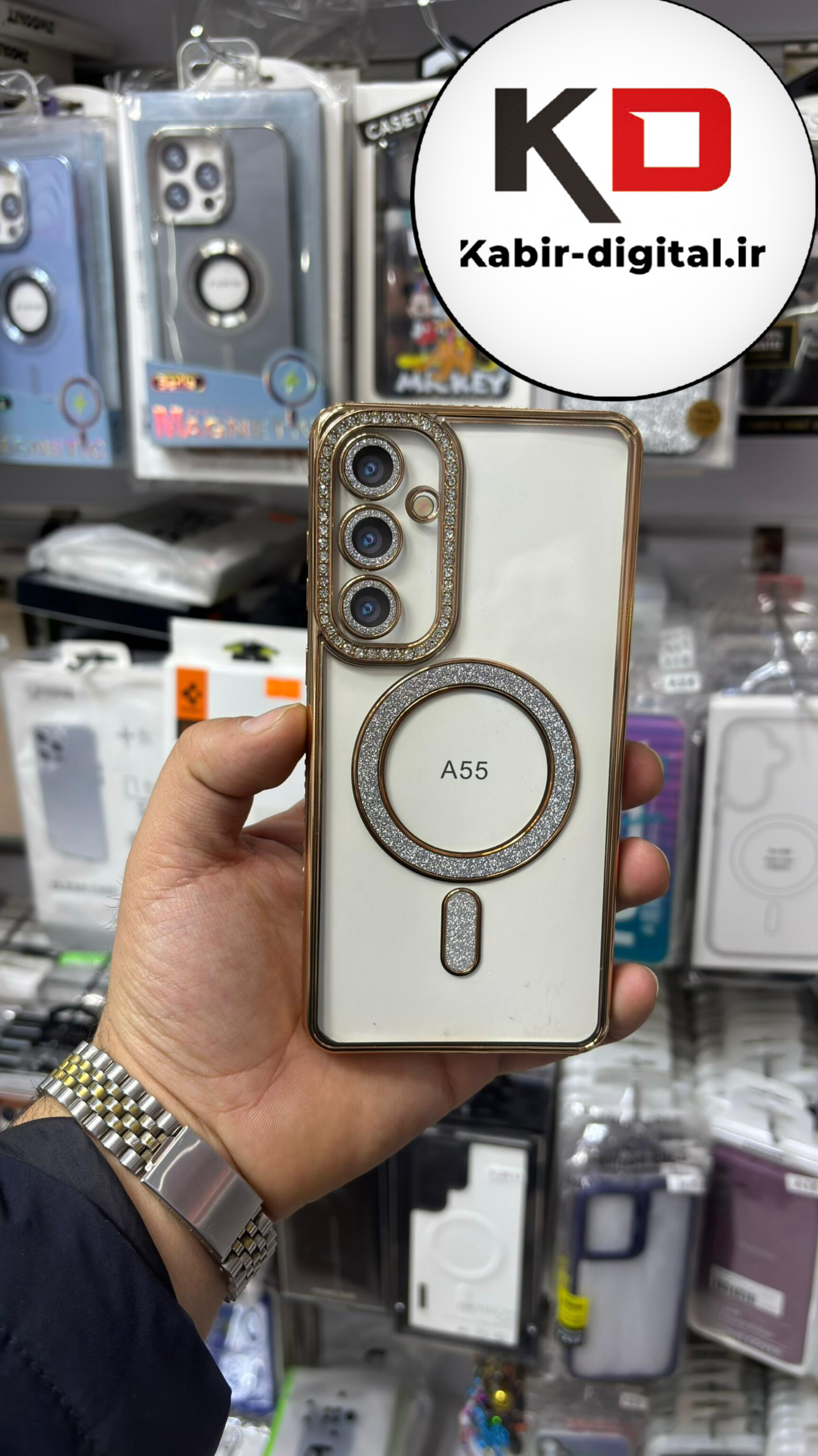 قاب گوشی Galaxy A55 سامسونگ الکتروپلیتینگ ژله ای شفاف اورجینال طرح مگ سیف نگین دار شاین محافظ لنز دار طلایی