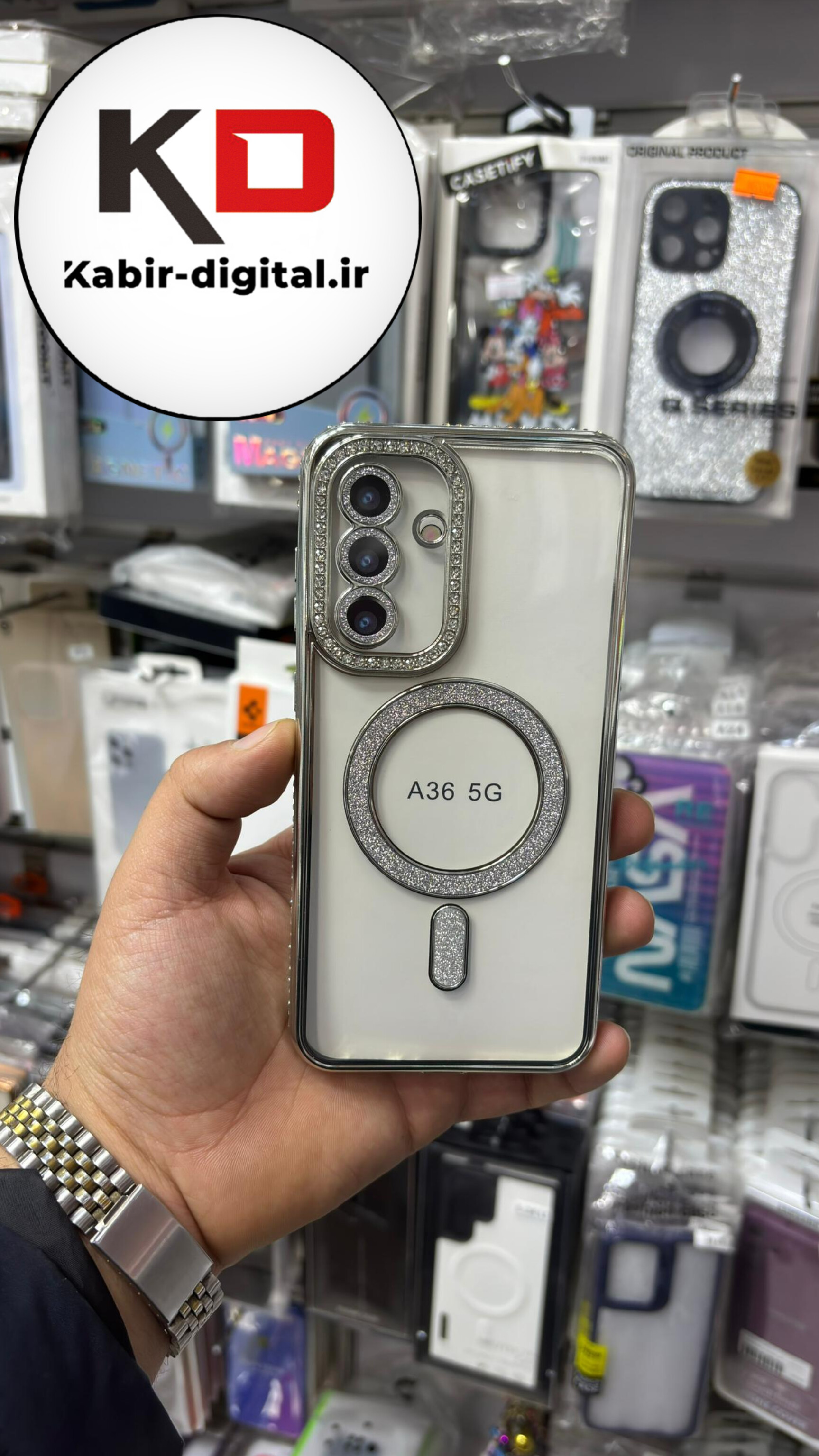قاب گوشی Galaxy A36 سامسونگ الکتروپلیتینگ ژله ای شفاف اورجینال طرح مگ سیف نگین دار شاین محافظ لنز دار نقره ایی