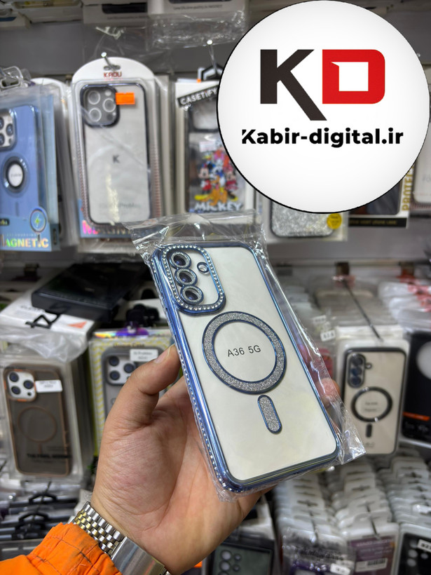 قاب گوشی Galaxy A36 سامسونگ الکتروپلیتینگ ژله ای شفاف اورجینال طرح مگ سیف محافظ لنز دار نگین دار آبی