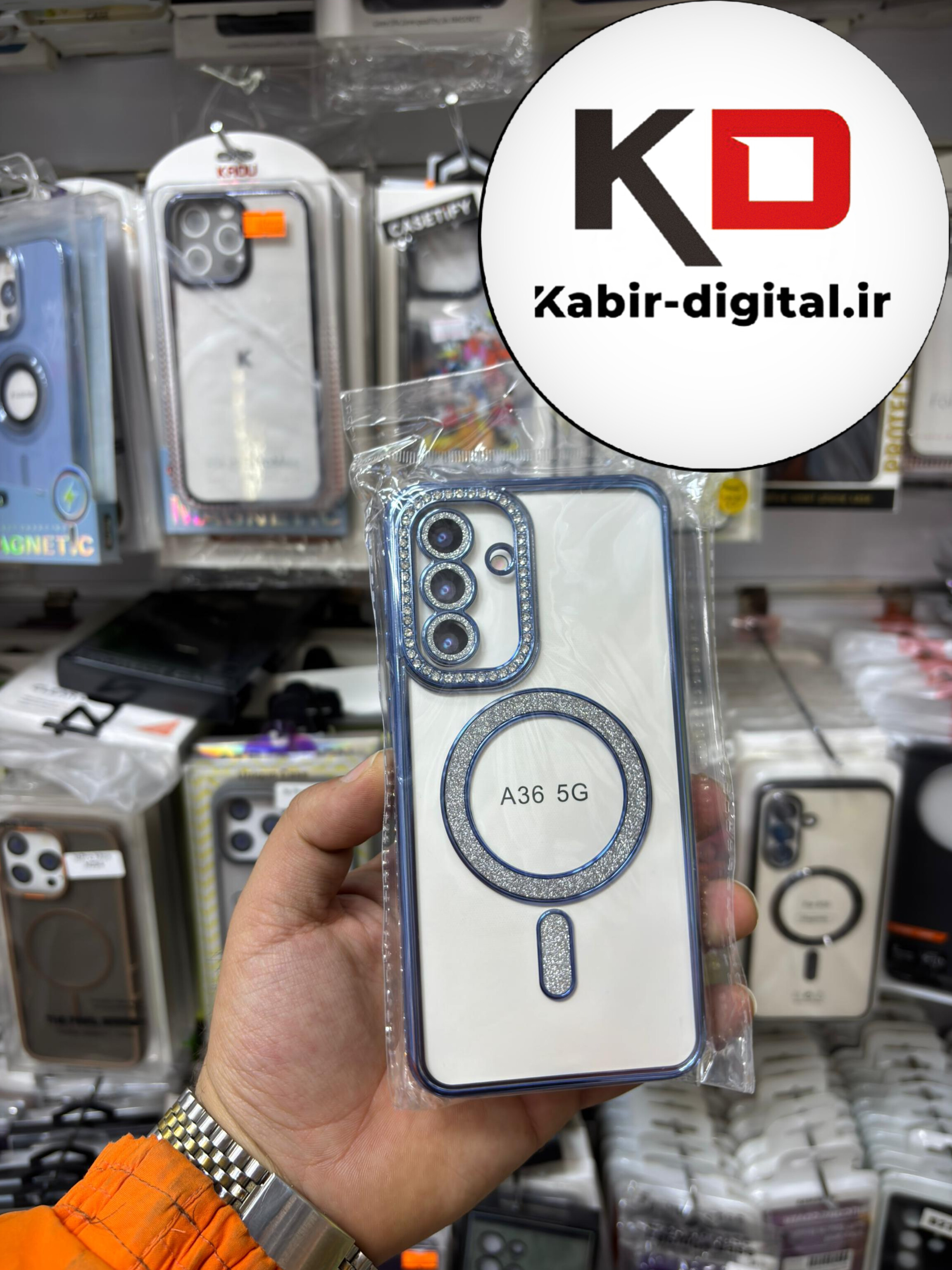 قاب گوشی Galaxy A36 سامسونگ الکتروپلیتینگ ژله ای شفاف اورجینال طرح مگ سیف محافظ لنز دار نگین دار آبی