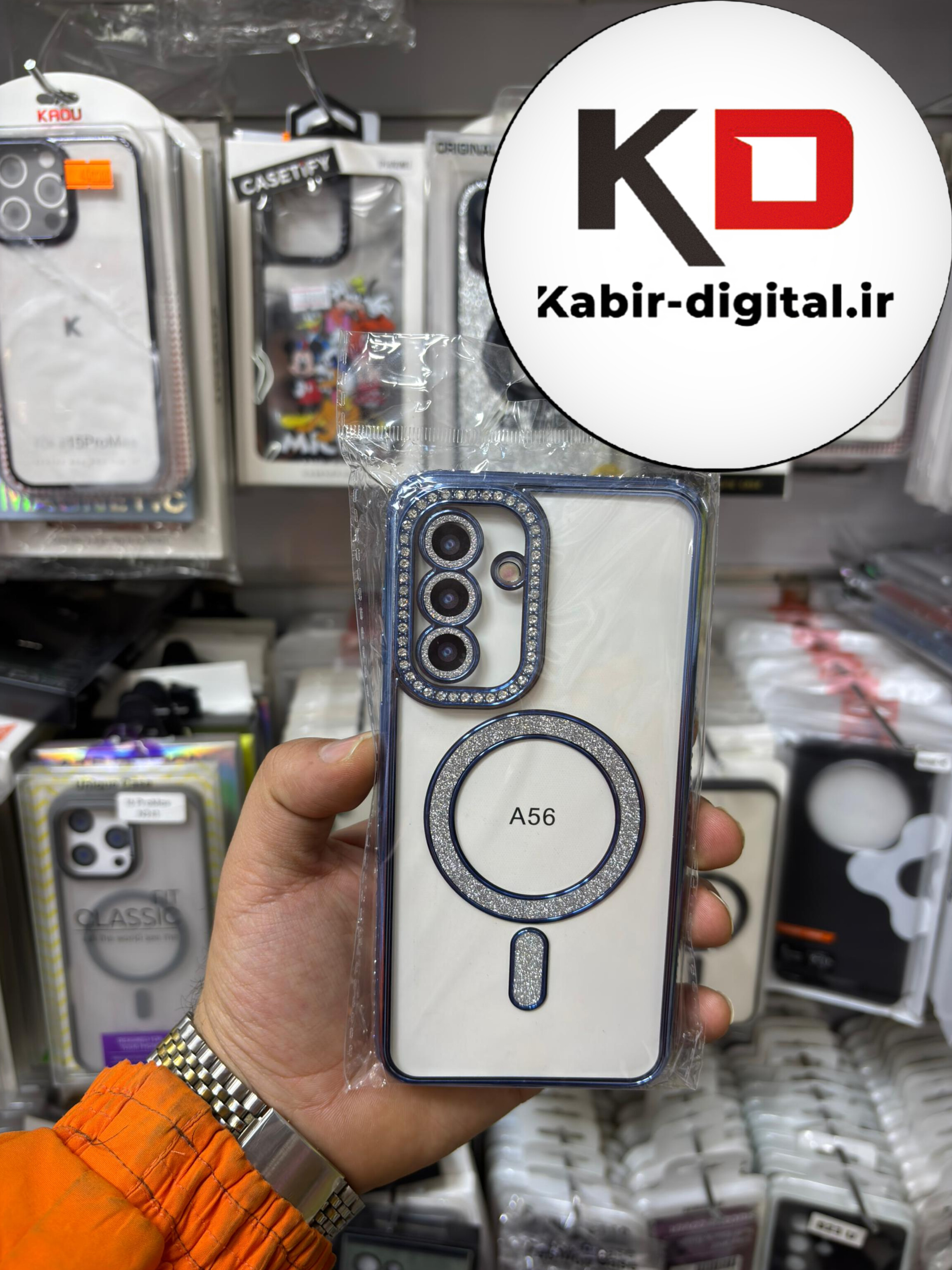 قاب گوشی Galaxy A56 سامسونگ الکتروپلیتینگ ژله ای شفاف اورجینال طرح مگ سیف محافظ لنز دار نگین دار آبی