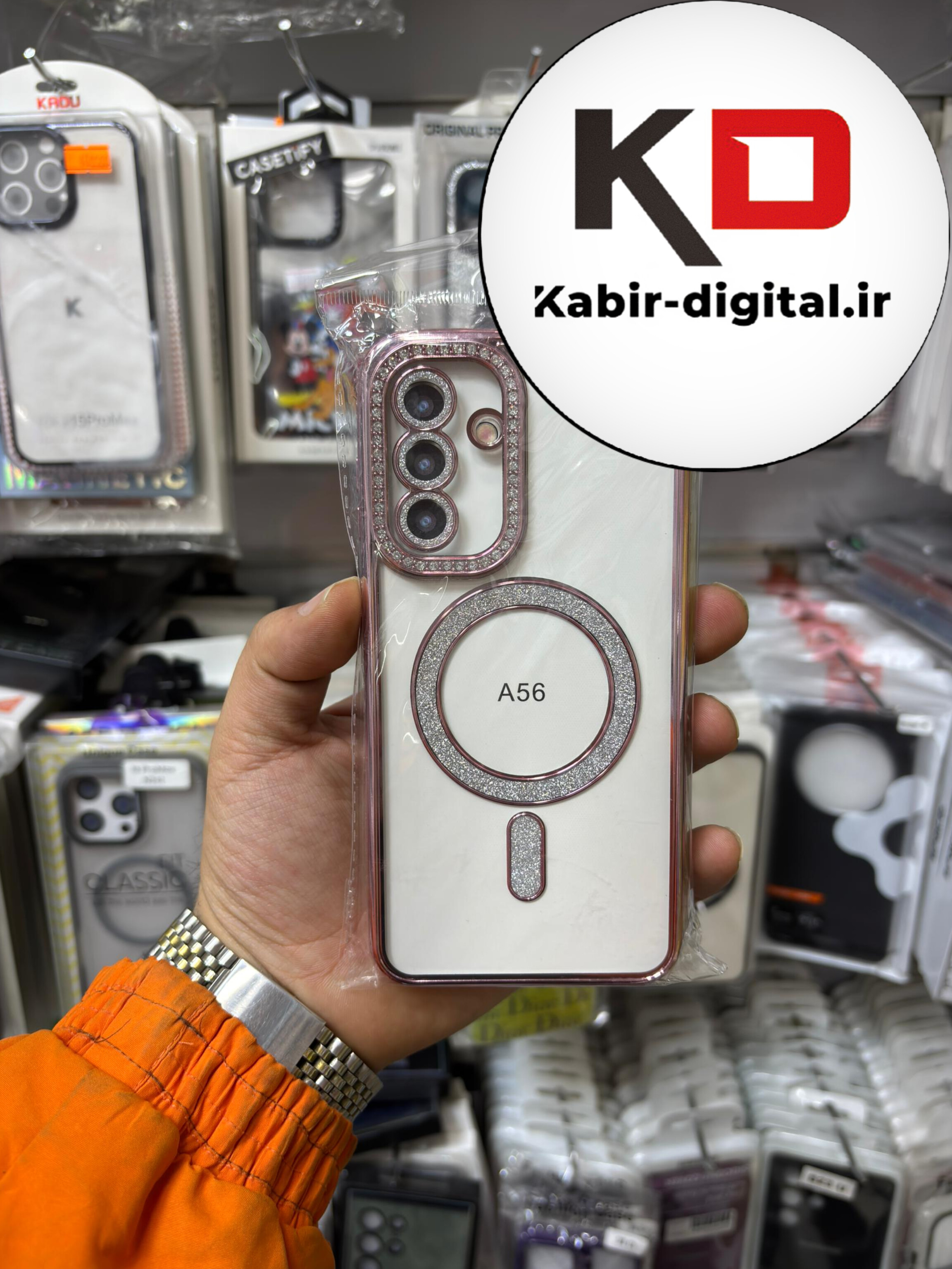 قاب گوشی Galaxy A56 سامسونگ الکتروپلیتینگ ژله ای شفاف اورجینال طرح مگ سیف محافظ لنز دار نگین دار صورتی