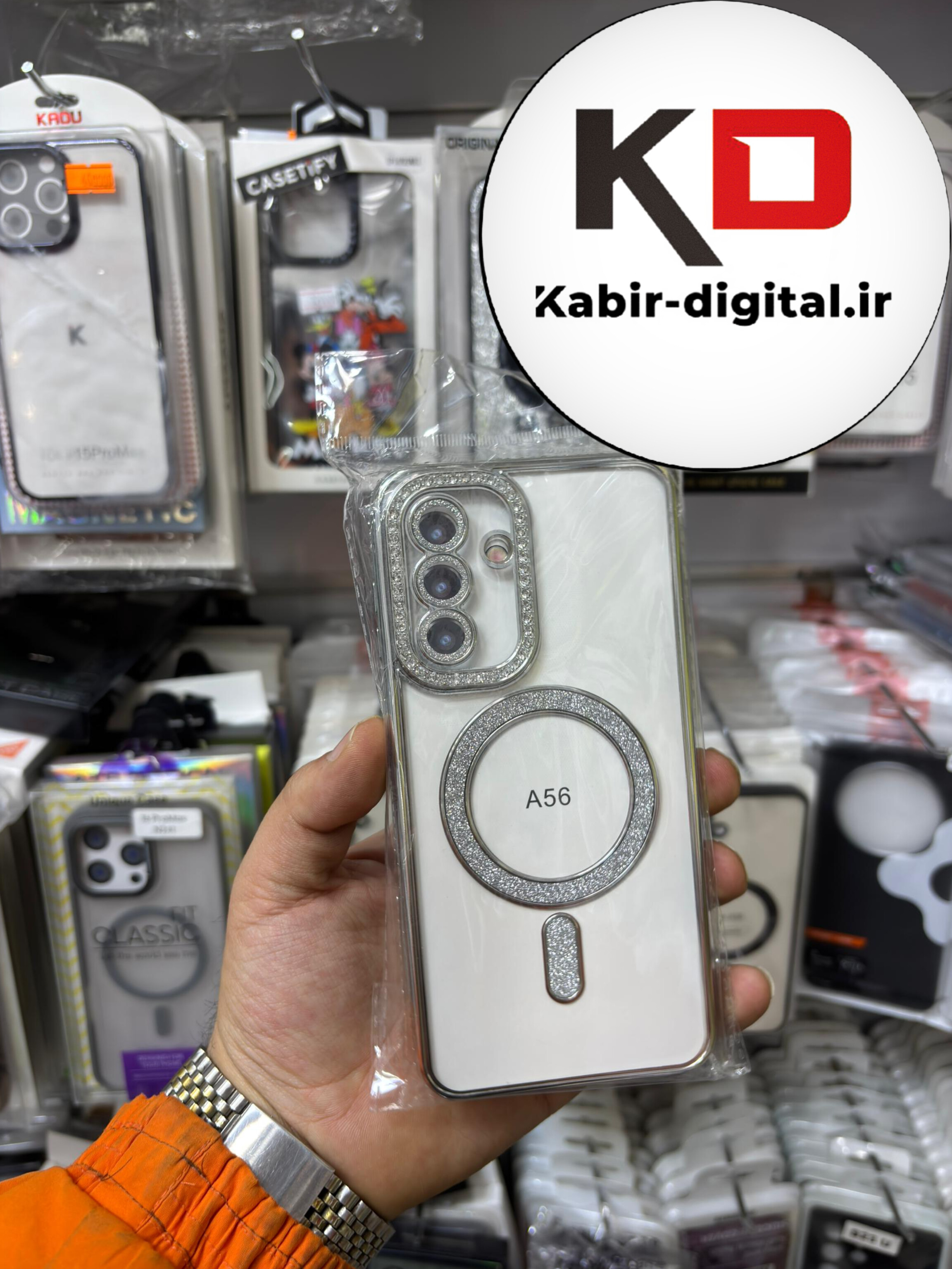 قاب گوشی Galaxy A56 سامسونگ الکتروپلیتینگ ژله ای شفاف اورجینال طرح مگ سیف محافظ لنز دار نگین دار طوسی