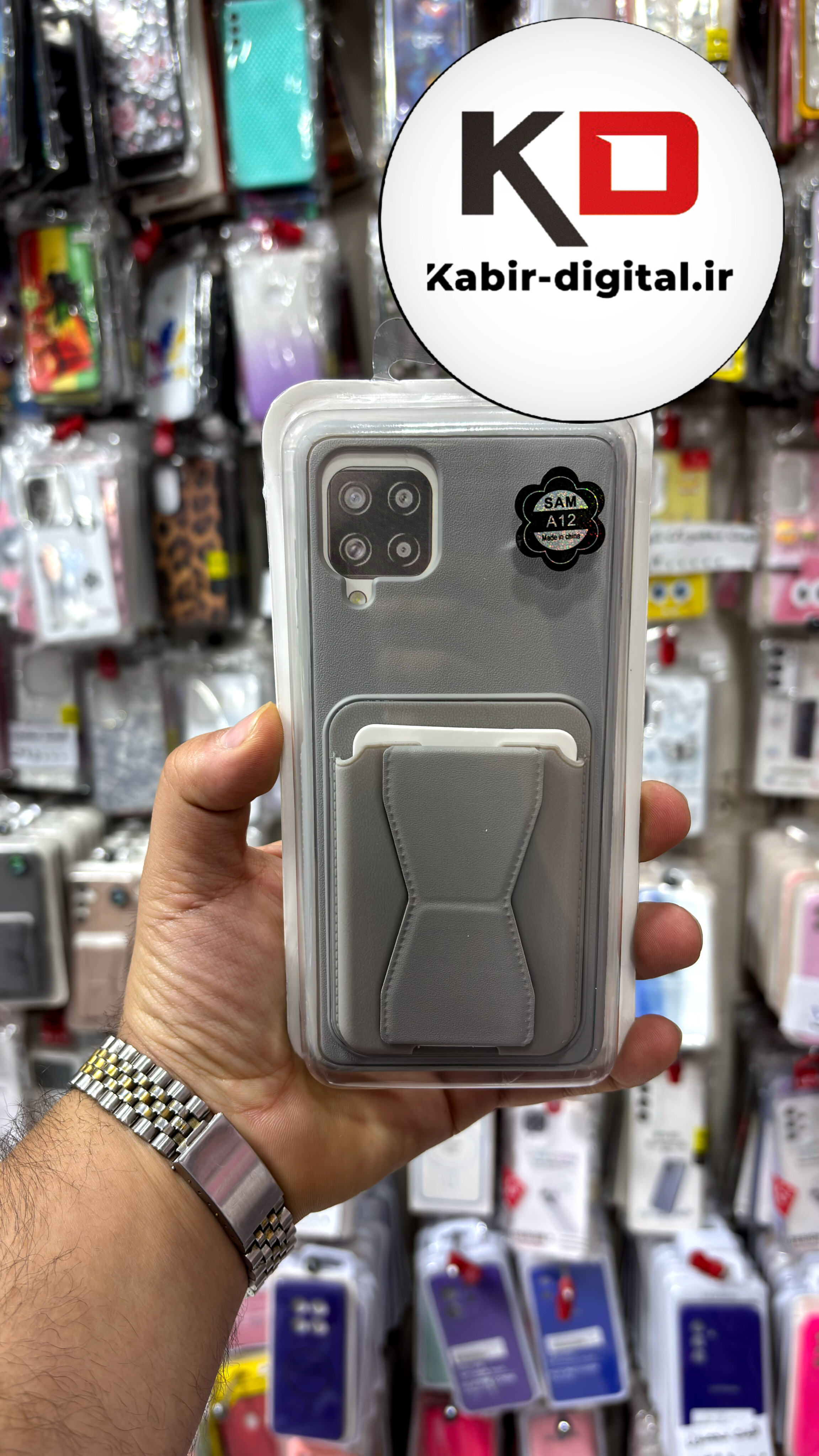 قاب گوشی Galaxy A12/M12 سامسونگ چرمی دوخت دار اورجینال جاکارتی دار مگنتی استندشو طوسی